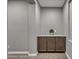 Hallway features built-in cabinetry with granite countertops for elegant storage at 22870 E Sonoqui Blvd, Queen Creek, AZ 85142