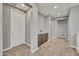 Upstairs loft featuring storage cabinet, neutral carpet, and ample space at 22870 E Sonoqui Blvd, Queen Creek, AZ 85142