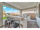 This outdoor kitchen features a built-in barbecue and bar for entertaining at 22870 E Sonoqui Blvd, Queen Creek, AZ 85142