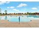 Large community pool offers clear water, sun loungers, and plenty of space to enjoy the sun at 22870 E Sonoqui Blvd, Queen Creek, AZ 85142