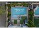 Aerial view of a backyard oasis featuring a sparkling pool, lush landscaping, and a private patio area, with no neighbors behind at 2339 E Questa Dr, Phoenix, AZ 85024