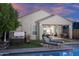 Inviting backyard with pool, spa, covered patio and lush greenery at 2339 E Questa Dr, Phoenix, AZ 85024