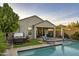Relaxing backyard featuring a refreshing pool, hot tub, and covered patio for outdoor entertaining at 2339 E Questa Dr, Phoenix, AZ 85024