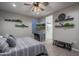 Well-lit bedroom with streaming device, full-length mirror, and access to the bath at 2339 E Questa Dr, Phoenix, AZ 85024