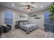 Comfortable bedroom with neutral tones, a ceiling fan, and ample natural light at 2339 E Questa Dr, Phoenix, AZ 85024