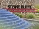 Beautiful stone entrance to the Stone Butte community with lush landscaping at 2339 E Questa Dr, Phoenix, AZ 85024