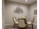Cozy dining area features a unique barrel-based table and modern decor at 2339 E Questa Dr, Phoenix, AZ 85024