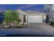 Charming single-Gathering home featuring a well-manicured front yard and a two-car garage at 2339 E Questa Dr, Phoenix, AZ 85024