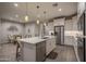 Spacious kitchen featuring stainless steel appliances, a large island, and an open layout connecting to the dining area at 2339 E Questa Dr, Phoenix, AZ 85024