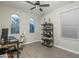 Bright home office with modern decor, ceiling fan, and multiple windows at 2339 E Questa Dr, Phoenix, AZ 85024