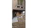 Covered front porch with decorative plants and a wooden swing, offering a welcoming entrance to the home at 23630 W Chambers St, Buckeye, AZ 85326