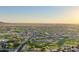 Community aerial view of homes next to desert golf course at sunrise at 2401 E Antigua Dr, Casa Grande, AZ 85194
