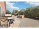 Private backyard space with covered patio, landscaping, and outdoor kitchen area at 2401 E Antigua Dr, Casa Grande, AZ 85194