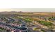 Aerial view of a community surrounded by a well-maintained golf course in the desert at 2401 E Antigua Dr, Casa Grande, AZ 85194