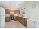 Functional kitchen featuring stainless steel appliances, ample counter space, and tile floors at 2401 E Antigua Dr, Casa Grande, AZ 85194