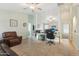 Inviting living room with tile flooring, modern furniture, and ample space for relaxation and work at 2401 E Antigua Dr, Casa Grande, AZ 85194