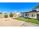 The backyard features gravel, a patch of artificial turf, a firepit, and a covered patio at 2421 E Dragoon Ave, Mesa, AZ 85204