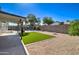 Attractive backyard with artificial grass, gravel landscaping, and a fenced swimming pool at 2421 E Dragoon Ave, Mesa, AZ 85204