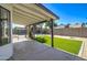 Lush artificial turf area and a fenced pool in a backyard providing a private and attractive outdoor living space at 2421 E Dragoon Ave, Mesa, AZ 85204