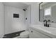Modern bathroom with white subway tile, sleek black fixtures, and a walk-in shower at 2421 E Dragoon Ave, Mesa, AZ 85204