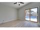 Bedroom featuring new floors and a slider out to the pool area at 2421 E Dragoon Ave, Mesa, AZ 85204