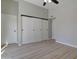 Bedroom featuring new floors and spacious closet for storage at 2421 E Dragoon Ave, Mesa, AZ 85204