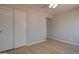 Bedroom featuring new floors, ceiling fan, and closets; a great room for relaxation at 2421 E Dragoon Ave, Mesa, AZ 85204