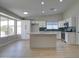 Kitchen features white cabinetry, island, stainless steel appliances and recessed lighting at 2421 E Dragoon Ave, Mesa, AZ 85204
