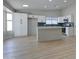 Bright kitchen features an island and ample counter space, open to the rest of the home at 2421 E Dragoon Ave, Mesa, AZ 85204