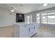 Bright kitchen with island, ample counter space, and a breakfast nook with great views at 2421 E Dragoon Ave, Mesa, AZ 85204