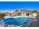 Backyard pool area surrounded by palm trees and fence in backyard at 2421 E Dragoon Ave, Mesa, AZ 85204