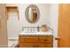 This bathroom features a custom tiled vanity with a framed mirror and floral accents at 2430 N 56Th St, Phoenix, AZ 85008