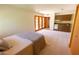 This room features a queen sized bed, kitchenette, and patio access through French doors at 2430 N 56Th St, Phoenix, AZ 85008