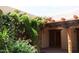 Lush courtyard with flowering vines and a charming wooden beam overhang at 2430 N 56Th St, Phoenix, AZ 85008