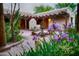 Lush courtyard featuring a decorative fountain, blooming flowers, and elegant architectural accents at 2430 N 56Th St, Phoenix, AZ 85008