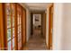 Hallway featuring a stone floor and wooden doors at 2430 N 56Th St, Phoenix, AZ 85008