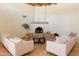 Bright living room with comfortable seating, a rustic fireplace, and neutral decor at 2430 N 56Th St, Phoenix, AZ 85008
