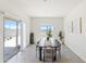 Bright dining area with sliding door, a window, and room for a table of six or more at 24559 W Flores Dr, Buckeye, AZ 85326