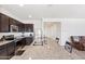 Kitchen island featuring granite countertops, stainless steel appliances, and dark cabinets at 24559 W Flores Dr, Buckeye, AZ 85326