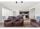 Cozy living room with kitchen and dining area views, perfect for entertaining at 24559 W Flores Dr, Buckeye, AZ 85326