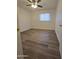 Bright bedroom with new floors, a ceiling fan and a window with blinds at 2544 N 52Nd Ave, Phoenix, AZ 85035