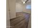 Cozy bedroom featuring new floors, a ceiling fan and a window with blinds at 2544 N 52Nd Ave, Phoenix, AZ 85035