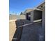 Exterior of the garage, with black door, gray paint, and concrete driveway at 2544 N 52Nd Ave, Phoenix, AZ 85035