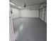 Spacious garage with painted floor and ample storage at 2544 N 52Nd Ave, Phoenix, AZ 85035