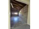 Garage with exposed rafters, block walls and a gray concrete floor at 2544 N 52Nd Ave, Phoenix, AZ 85035