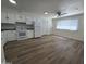 Modern kitchen featuring white cabinets, subway tile backsplash, and hardwood floors at 2544 N 52Nd Ave, Phoenix, AZ 85035
