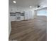 Modern kitchen featuring white cabinets, subway tile backsplash, and hardwood floors at 2544 N 52Nd Ave, Phoenix, AZ 85035