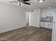 Bright living room featuring new floors adjacent to the kitchen, creating an open, inviting space at 2544 N 52Nd Ave, Phoenix, AZ 85035