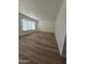 Bright living room featuring hardwood floors, neutral paint, and large windows at 2544 N 52Nd Ave, Phoenix, AZ 85035