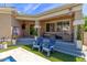 Inviting covered back patio with comfortable seating and views of a sparkling pool at 2634 E Tamarisk St, Gilbert, AZ 85296